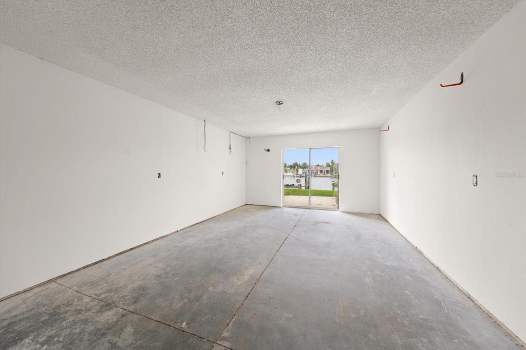124 Marcdale Boulevard Indian Rocks Beach, FL 33785 - Photo 23 of 55 a view of an empty room with a window