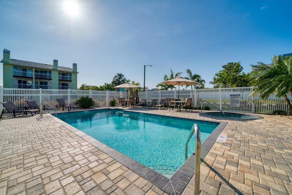 124 Marcdale Boulevard Indian Rocks Beach, FL 33785 - Photo 25 of 55 a view of a swimming pool with a patio