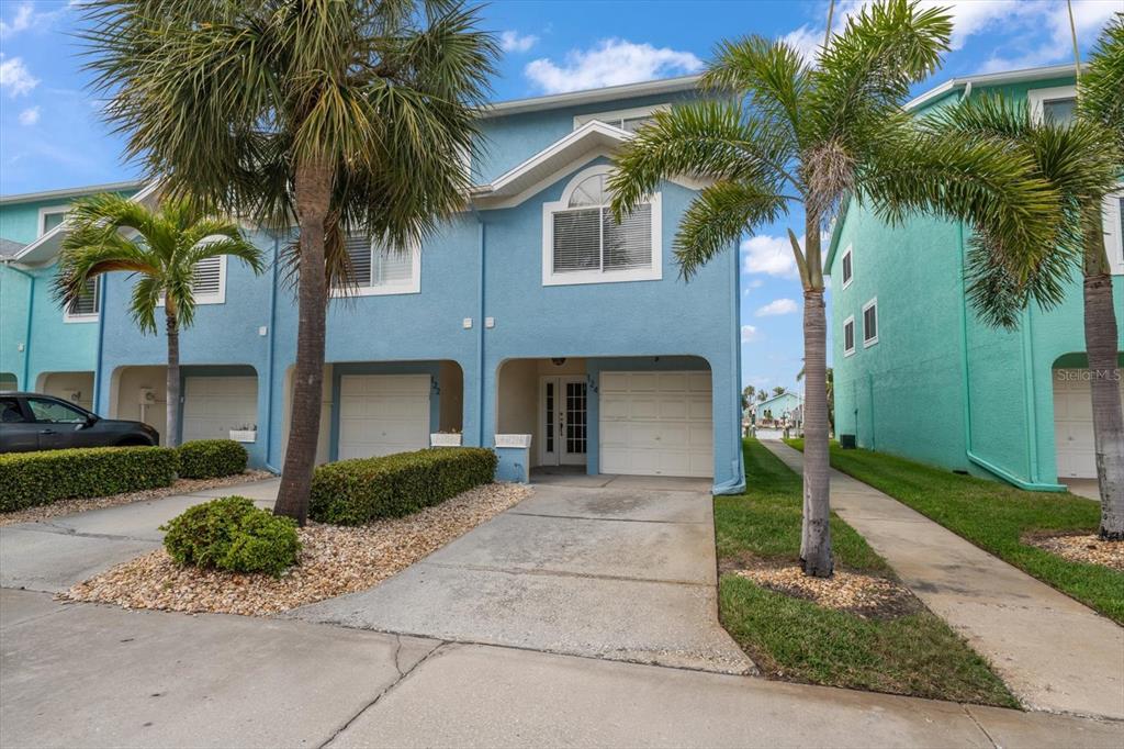 124 Marcdale Boulevard Indian Rocks Beach, FL 33785 - Photo 27 of 55 a front view of house with yard and green space
