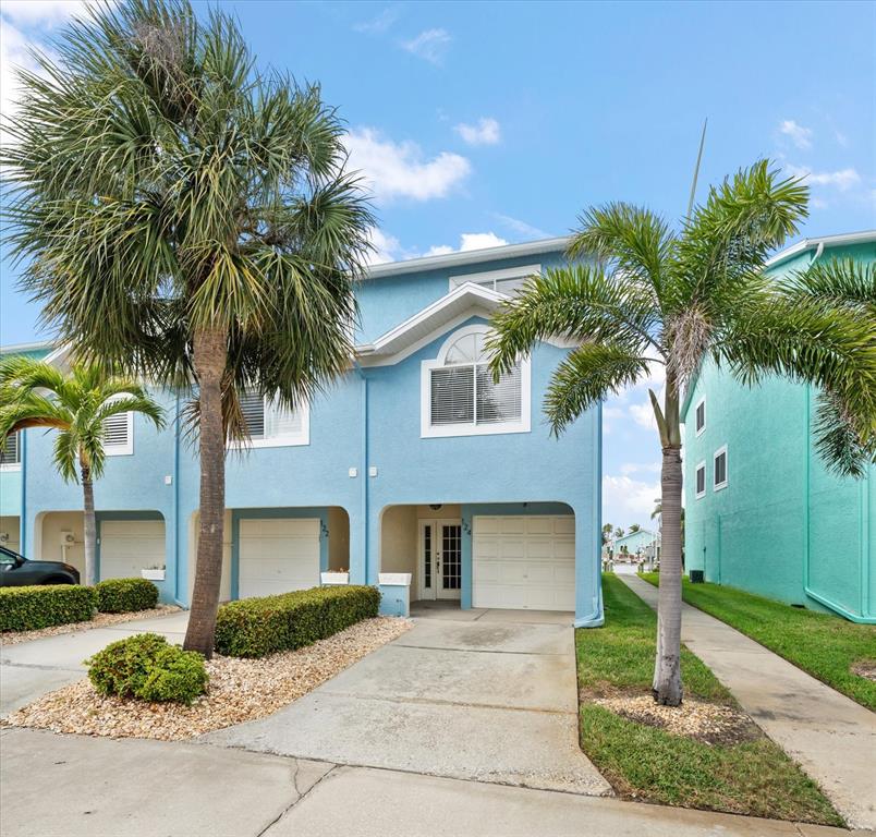 124 Marcdale Boulevard Indian Rocks Beach, FL 33785 - Photo 29 of 55 a front view of house with yard and green space