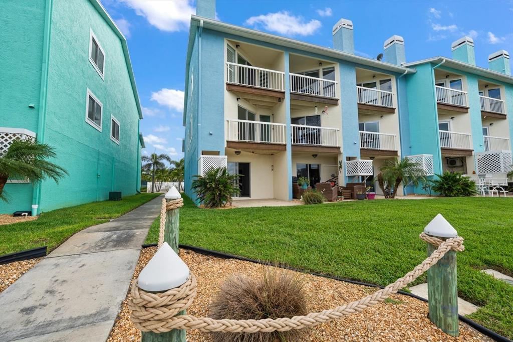 124 Marcdale Boulevard Indian Rocks Beach, FL 33785 - Photo 30 of 55 a house view with a garden space