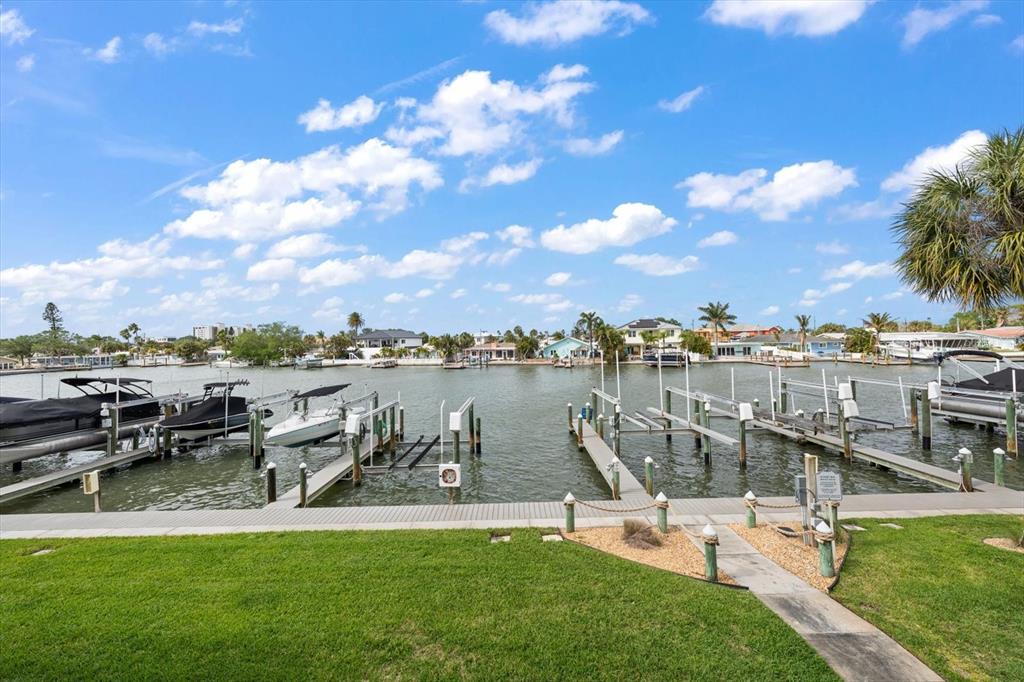 124 Marcdale Boulevard Indian Rocks Beach, FL 33785 - Photo 31 of 55 a view of a lake with houses in the back