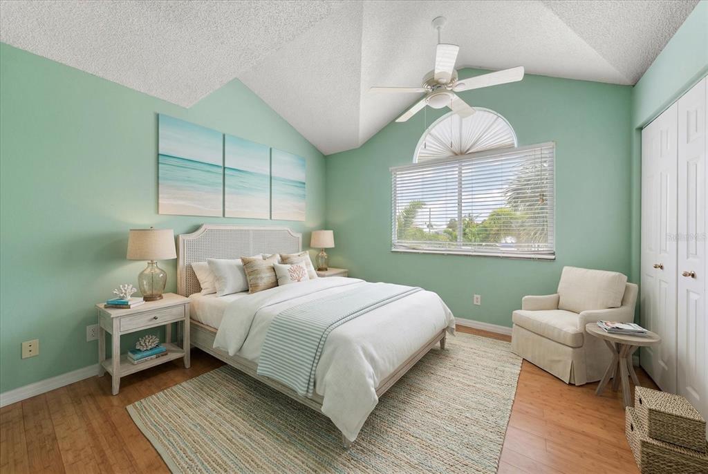 124 Marcdale Boulevard Indian Rocks Beach, FL 33785 - Photo 35 of 55 a bedroom with a bed and a window