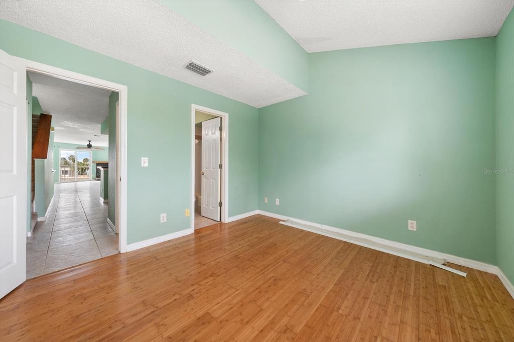 124 Marcdale Boulevard Indian Rocks Beach, FL 33785 - Photo 43 of 55 wooden floor in an empty room