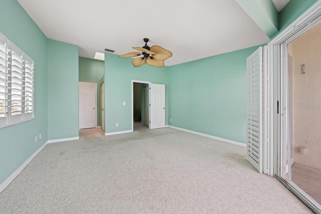 124 Marcdale Boulevard Indian Rocks Beach, FL 33785 - Photo 49 of 55 a view of a room with a ceiling fan and window