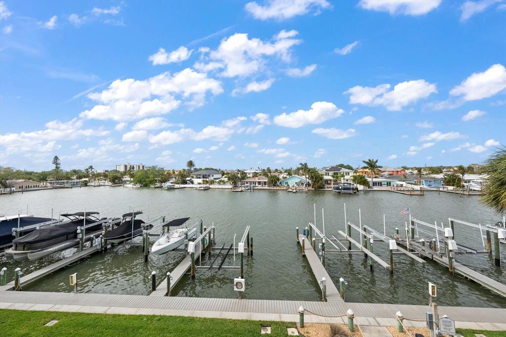 124 Marcdale Boulevard Indian Rocks Beach, FL 33785 - Photo 51 of 55 a view of a lake with houses in the back