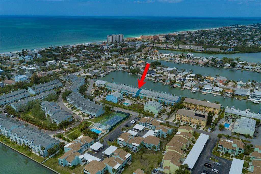 124 Marcdale Boulevard Indian Rocks Beach, FL 33785 - Photo 52 of 55 an aerial view of a city with lots of residential buildings ocean and mountain view in back