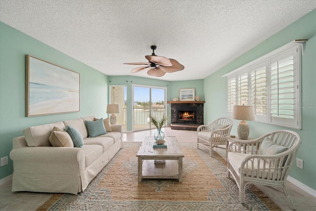 124 Marcdale Boulevard Indian Rocks Beach, FL 33785 - Photo 7 of 55 a living room with furniture and a large window
