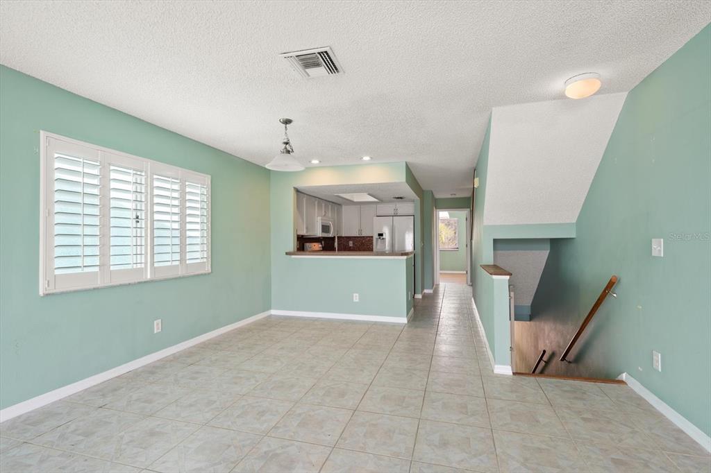 124 Marcdale Boulevard Indian Rocks Beach, FL 33785 - Photo 8 of 55 a view of a kitchen with furniture and a window