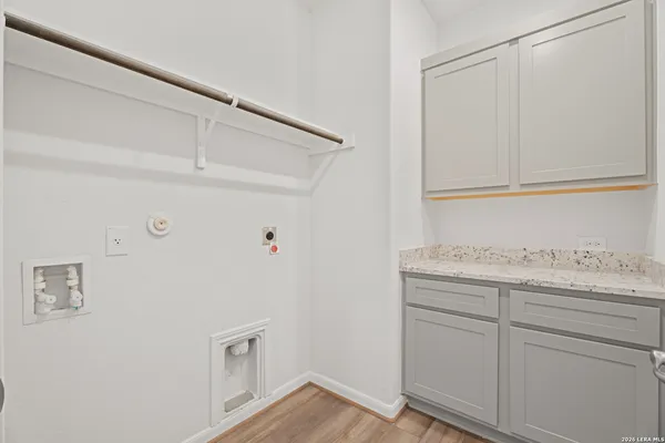 a view of cabinets with wooden floor