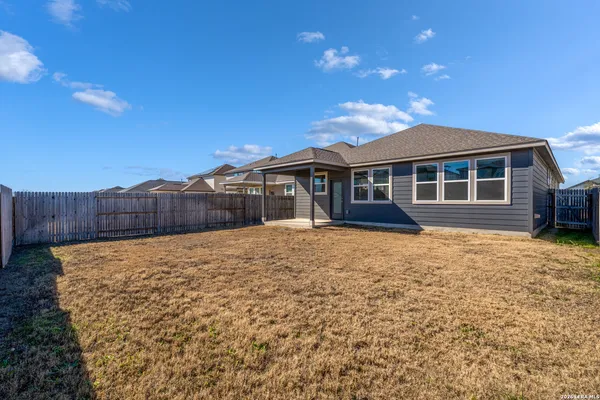 a house view with a backyard space