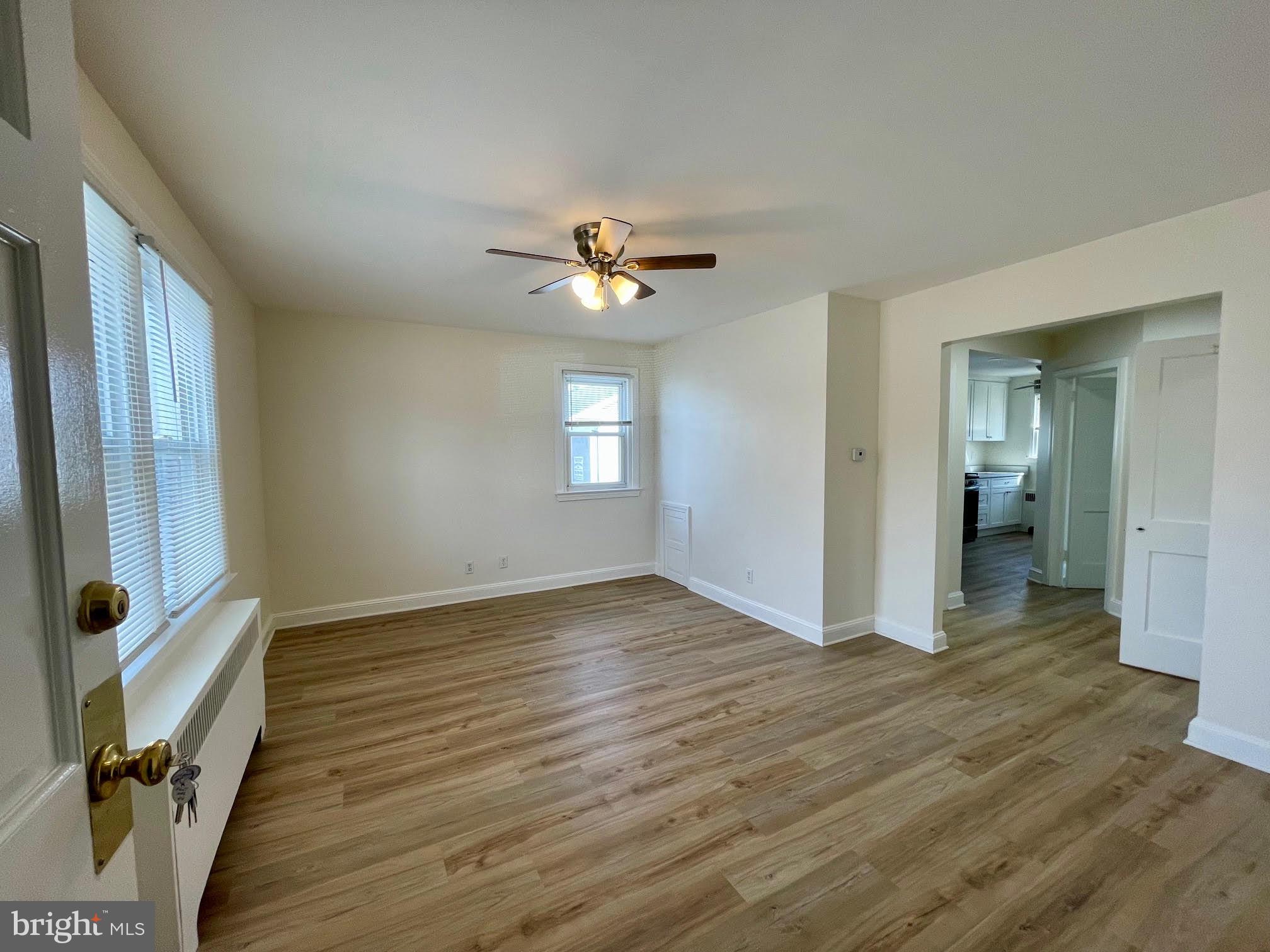 416 East Providence Road Aldan, PA 19018 - Photo 1 of 12 wooden floor in an empty room with a window