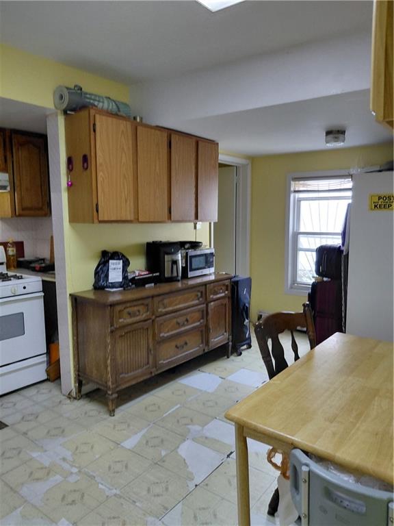 72 Brighton 1st Lane Brooklyn, NY 11235 - Photo 4 of 10 a kitchen with a cabinets and appliances