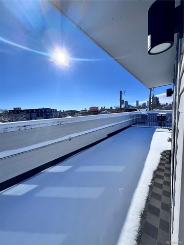 a view of a chairs and table in a patio