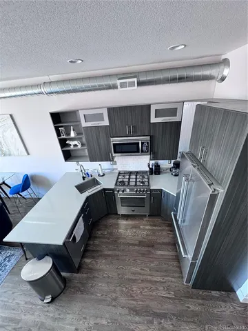 a bedroom with a bed and a large mirror