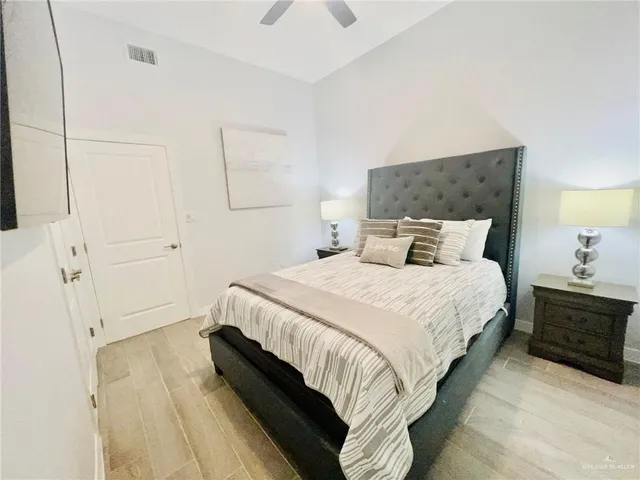 a bedroom with a bed and window