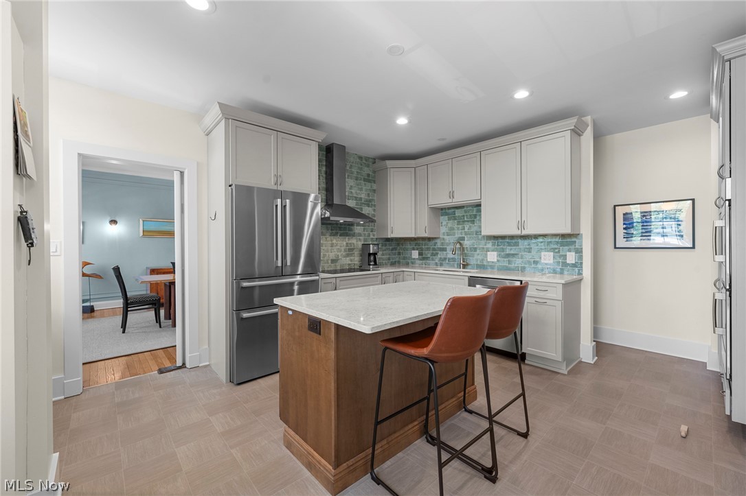 12546 Cedar Road, Unit 4 Cleveland Heights, OH 44106 - Photo 15 of 43 Newer windows, gourmet Kitchen taken down to the studs with center island and breakfast bar, 2 sinks, quartz counters, all Bosch stainless appliances with induction range and 2 ovens for large gatherings