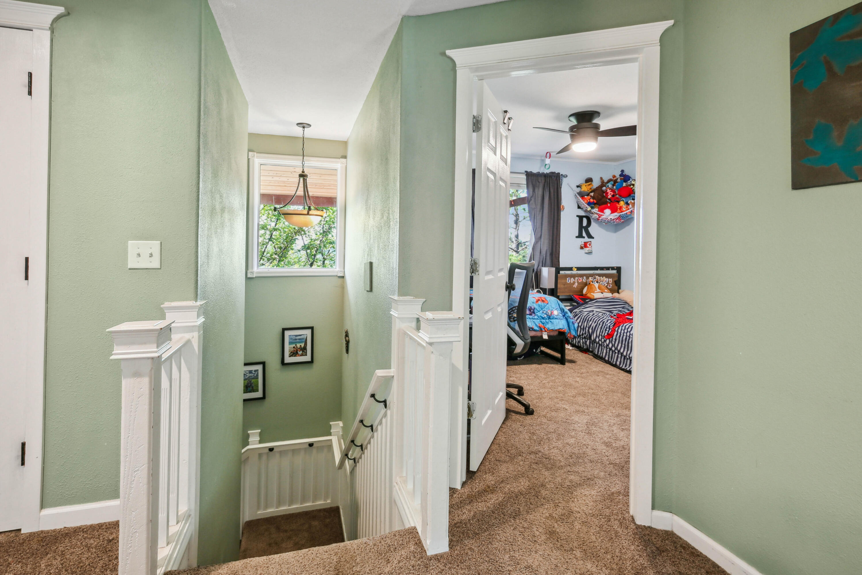 448 Wren Ridge Drive Eagle Point, OR 97524 - Photo 13 of 45 a view of a hallway with a livingroom and a window