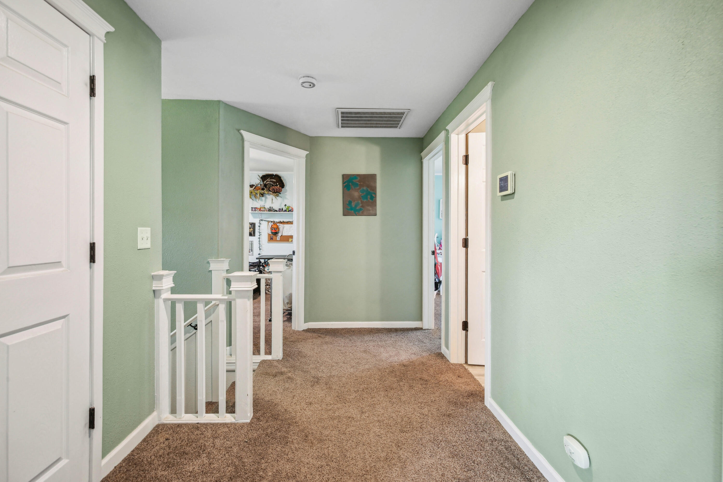 448 Wren Ridge Drive Eagle Point, OR 97524 - Photo 14 of 45 a view of a hallway with wooden shelves