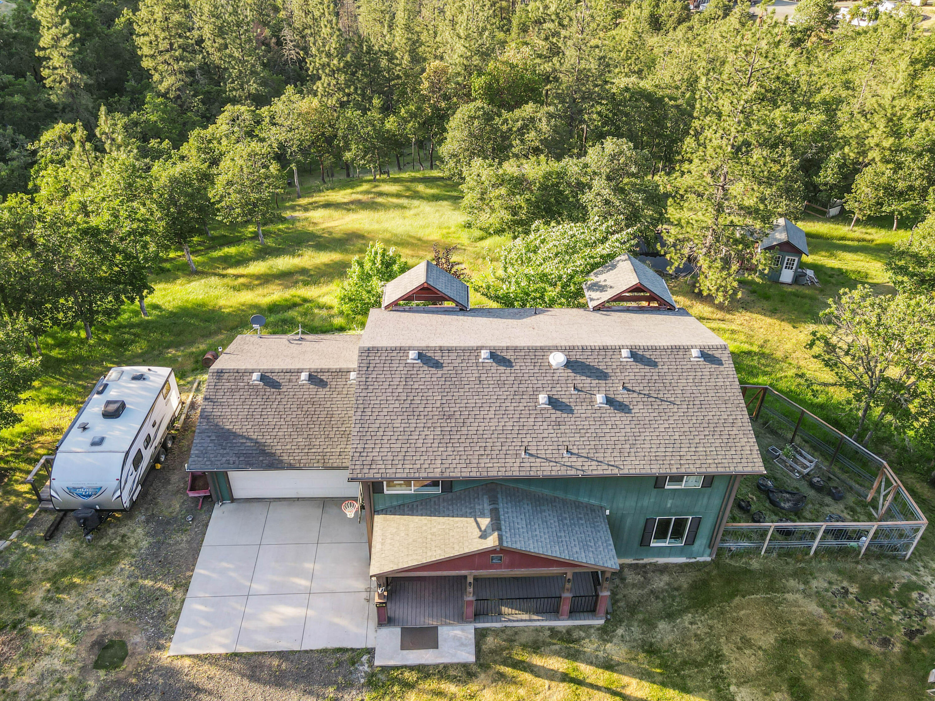 448 Wren Ridge Drive Eagle Point, OR 97524 - Photo 2 of 45 an aerial view of a house with garden space and a patio