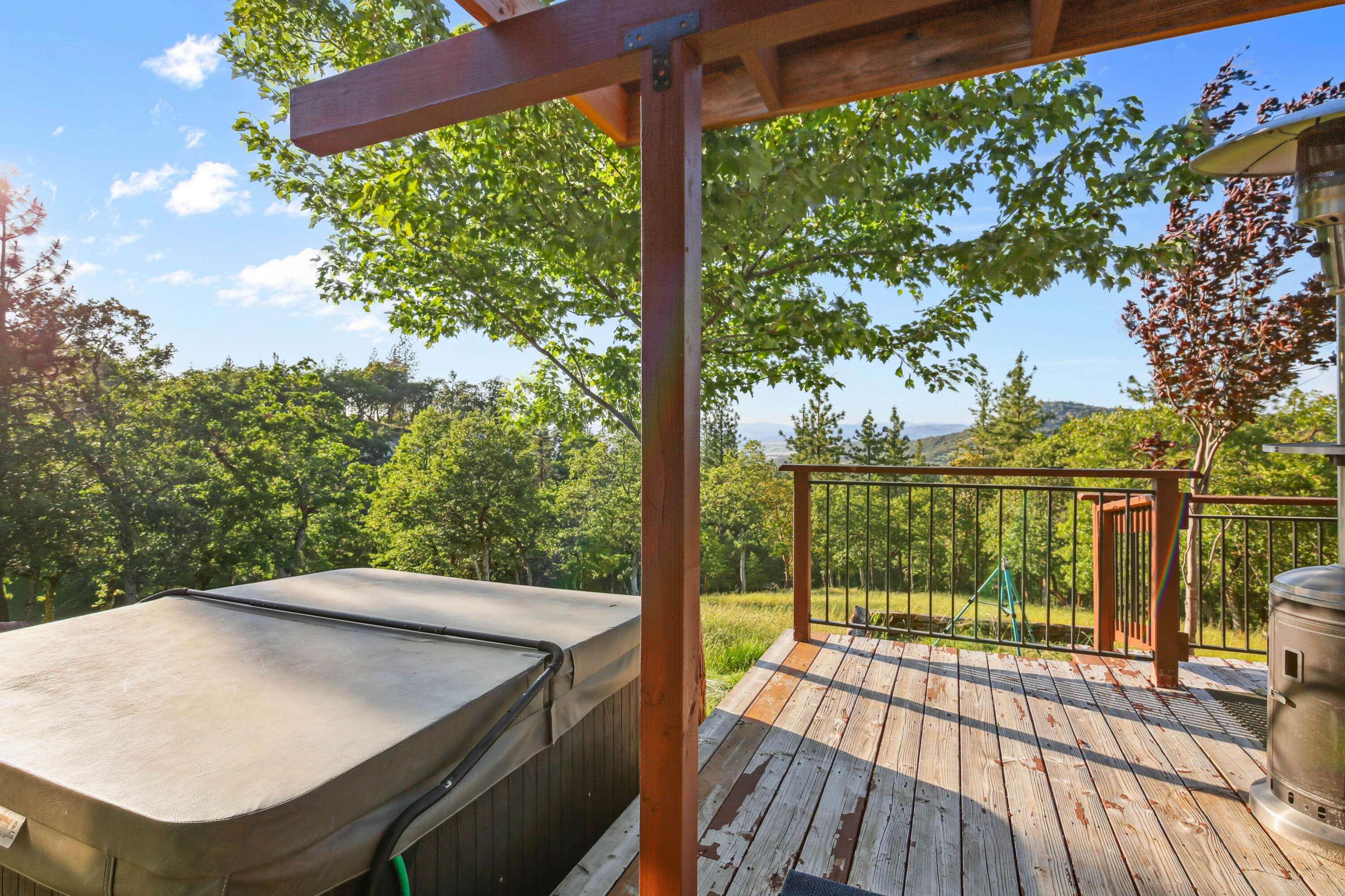 448 Wren Ridge Drive Eagle Point, OR 97524 - Photo 29 of 45 a view of a balcony with floor to ceiling windows with wooden floor
