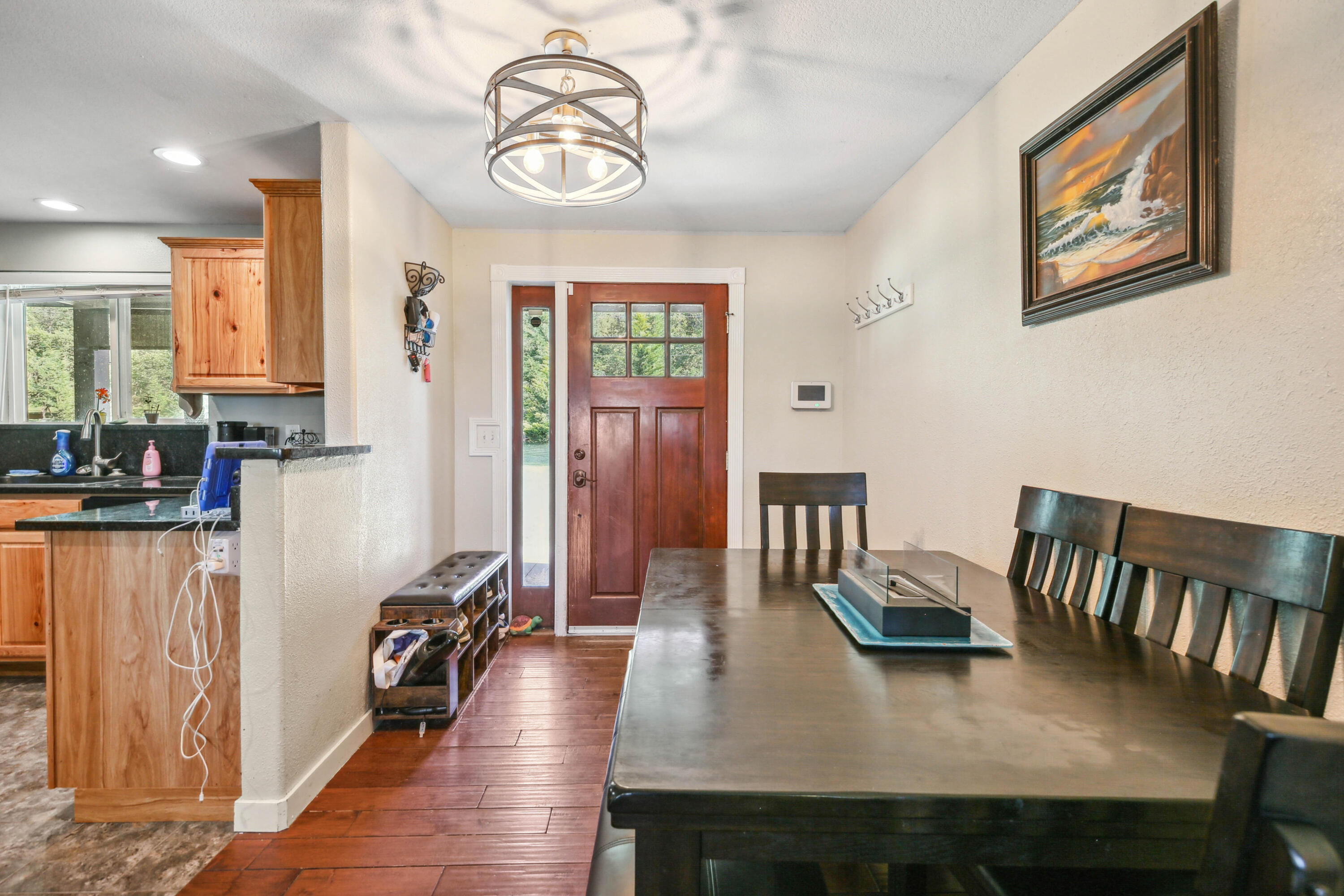 448 Wren Ridge Drive Eagle Point, OR 97524 - Photo 3 of 45 a view of a dining room with furniture and a chandelier