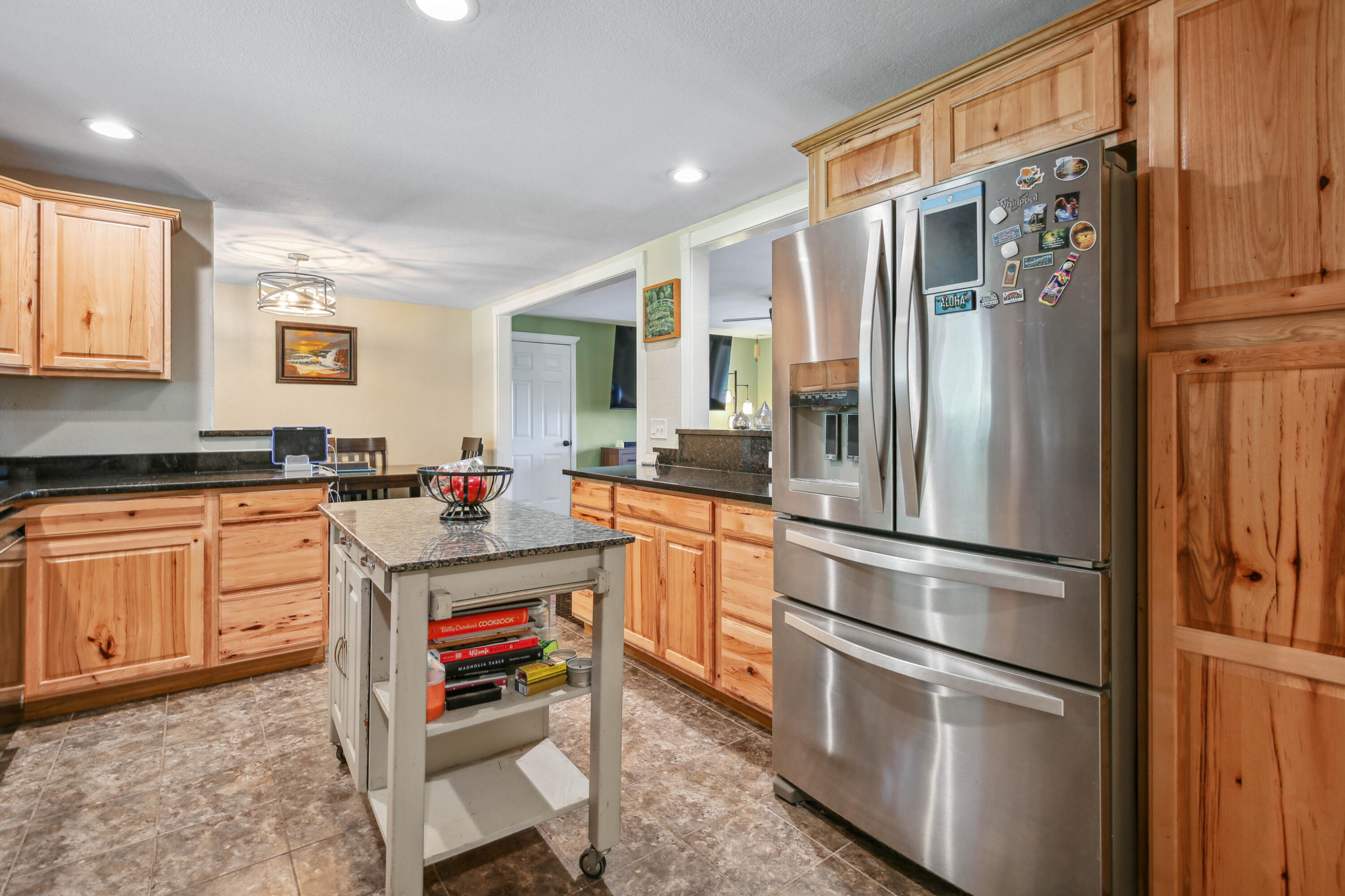 448 Wren Ridge Drive Eagle Point, OR 97524 - Photo 7 of 45 a kitchen with stainless steel appliances a refrigerator sink and cabinets