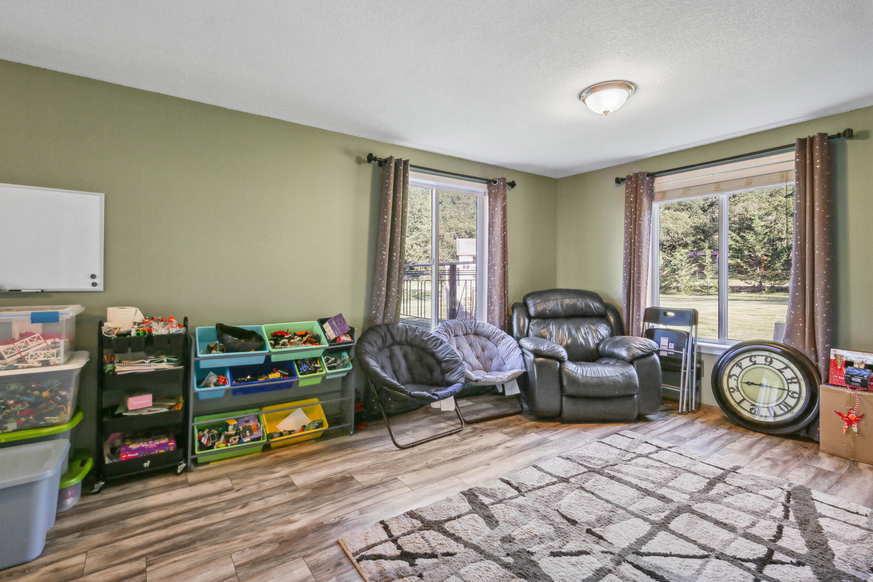 448 Wren Ridge Drive Eagle Point, OR 97524 - Photo 10 of 45 a living room with lots of furniture and a wooden floor