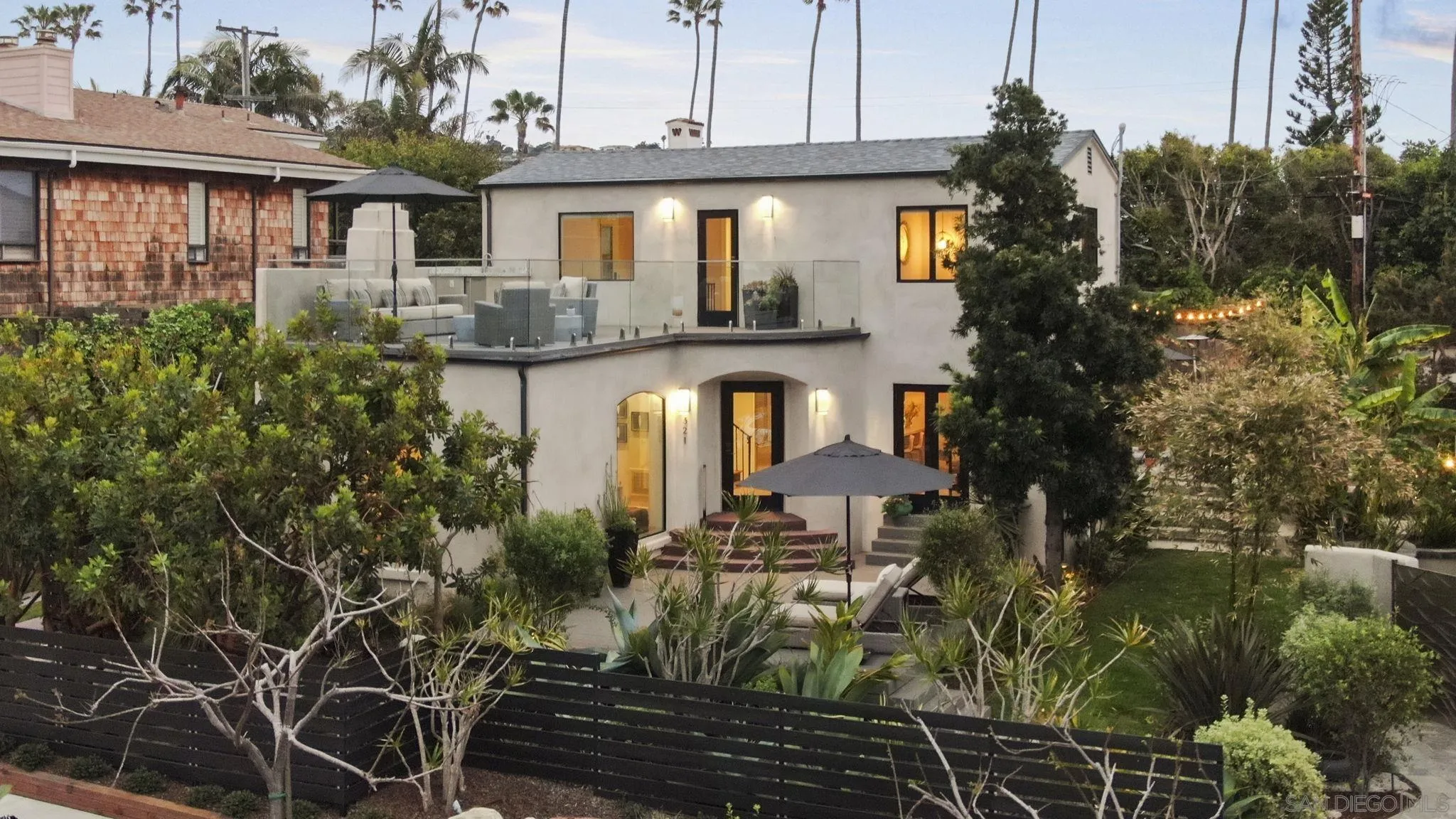 321 Fern Glen La Jolla, CA 92037 - Photo 1 of 46 a front view of a house with garden