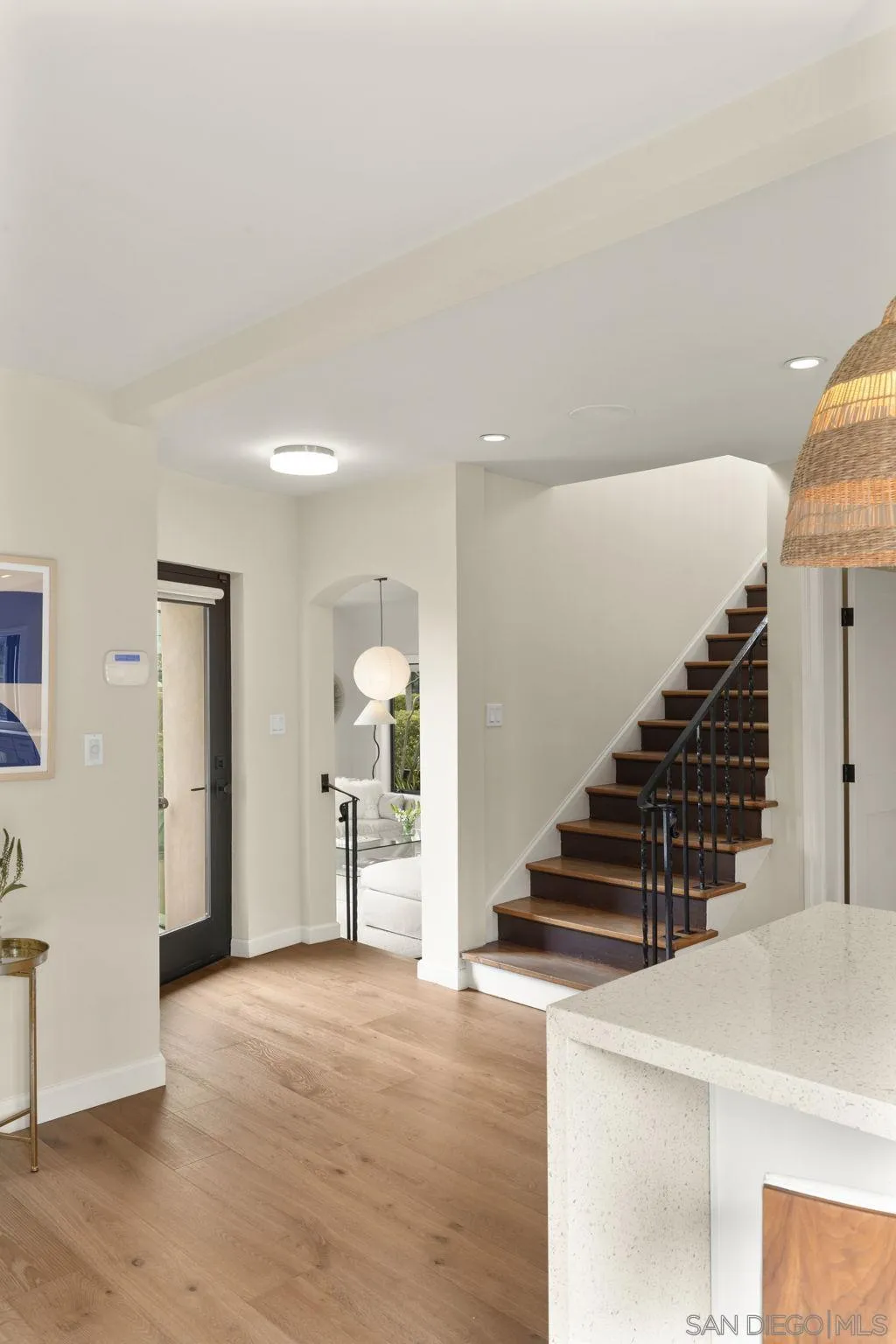 321 Fern Glen La Jolla, CA 92037 - Photo 16 of 46 a view of a hallway with wooden floor and stairs