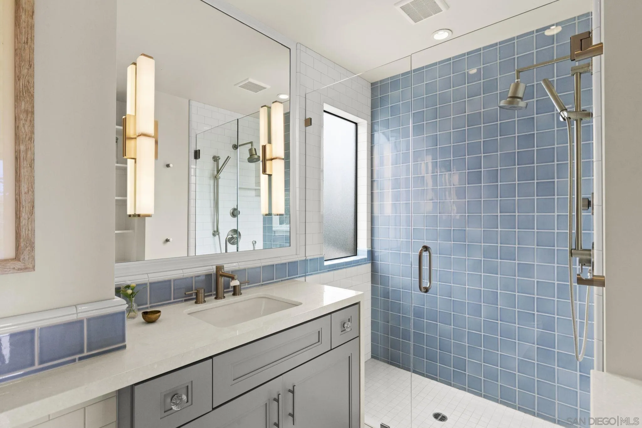 321 Fern Glen La Jolla, CA 92037 - Photo 19 of 46 a bathroom with a shower sink and mirror