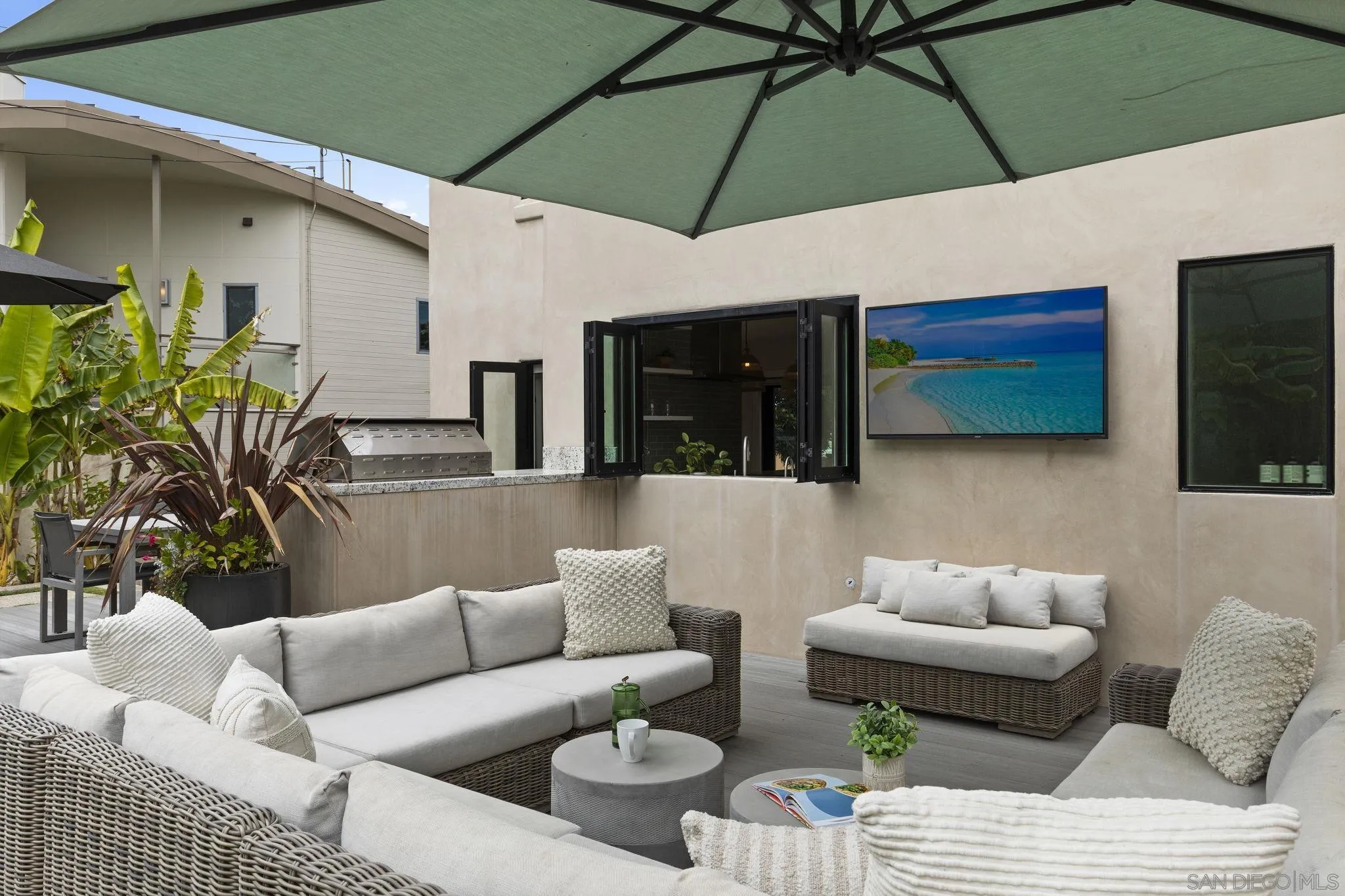 321 Fern Glen La Jolla, CA 92037 - Photo 28 of 46 a balcony with furniture and a umbrella