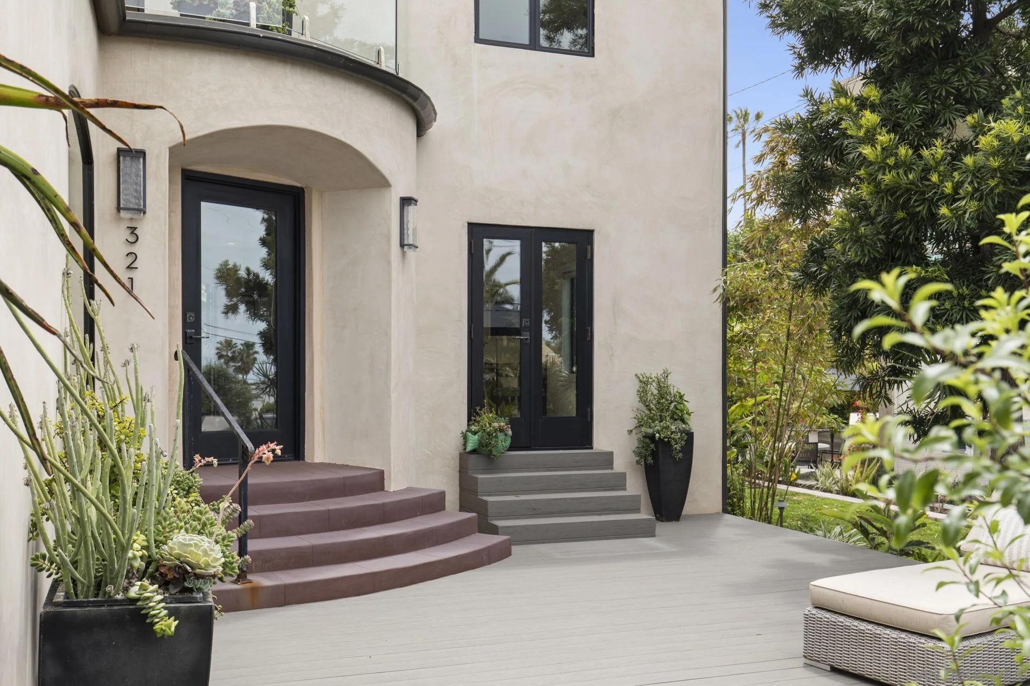 321 Fern Glen La Jolla, CA 92037 - Photo 3 of 46 a front view of a house with a garden