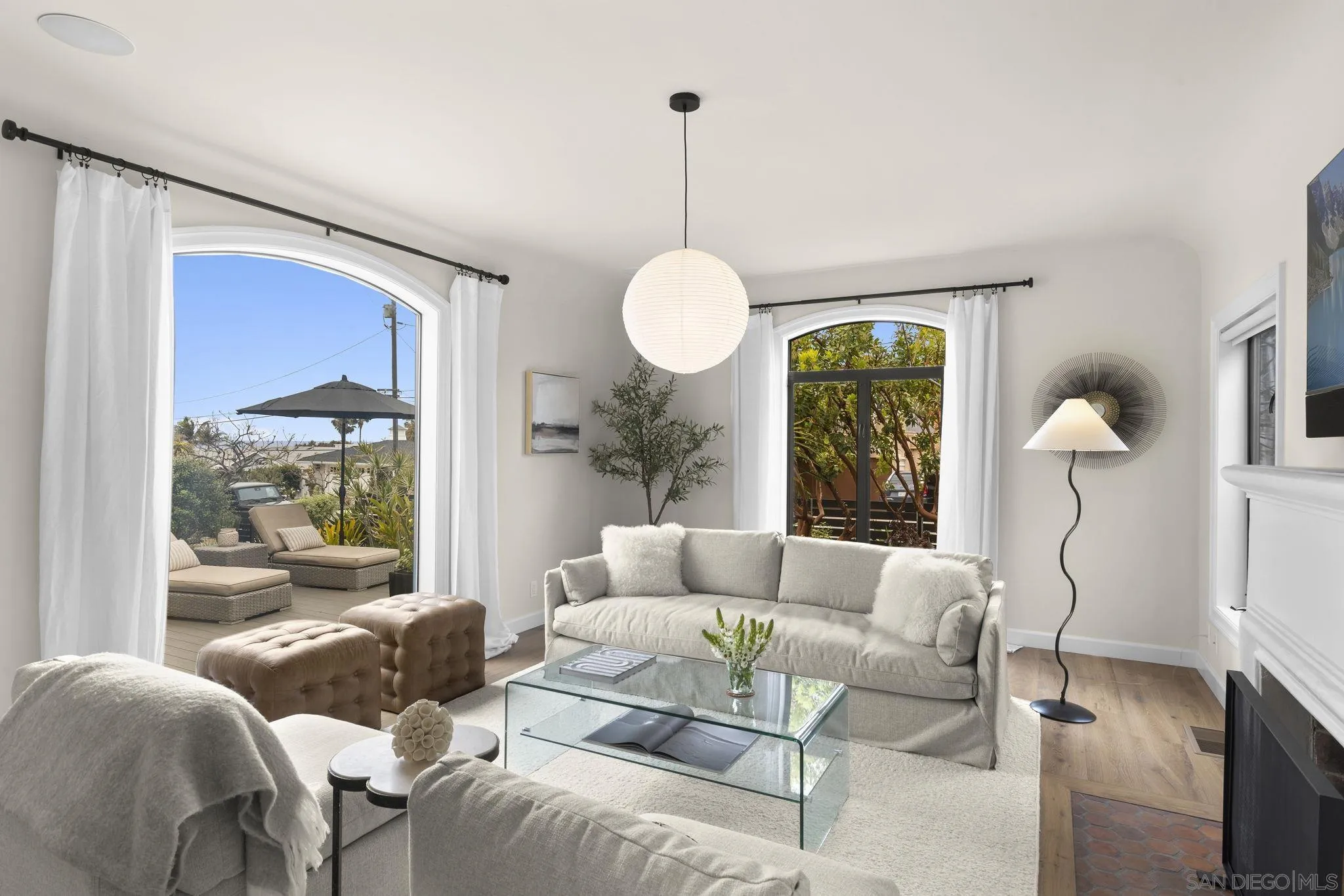 321 Fern Glen La Jolla, CA 92037 - Photo 4 of 46 a living room with furniture chandelier and a large window