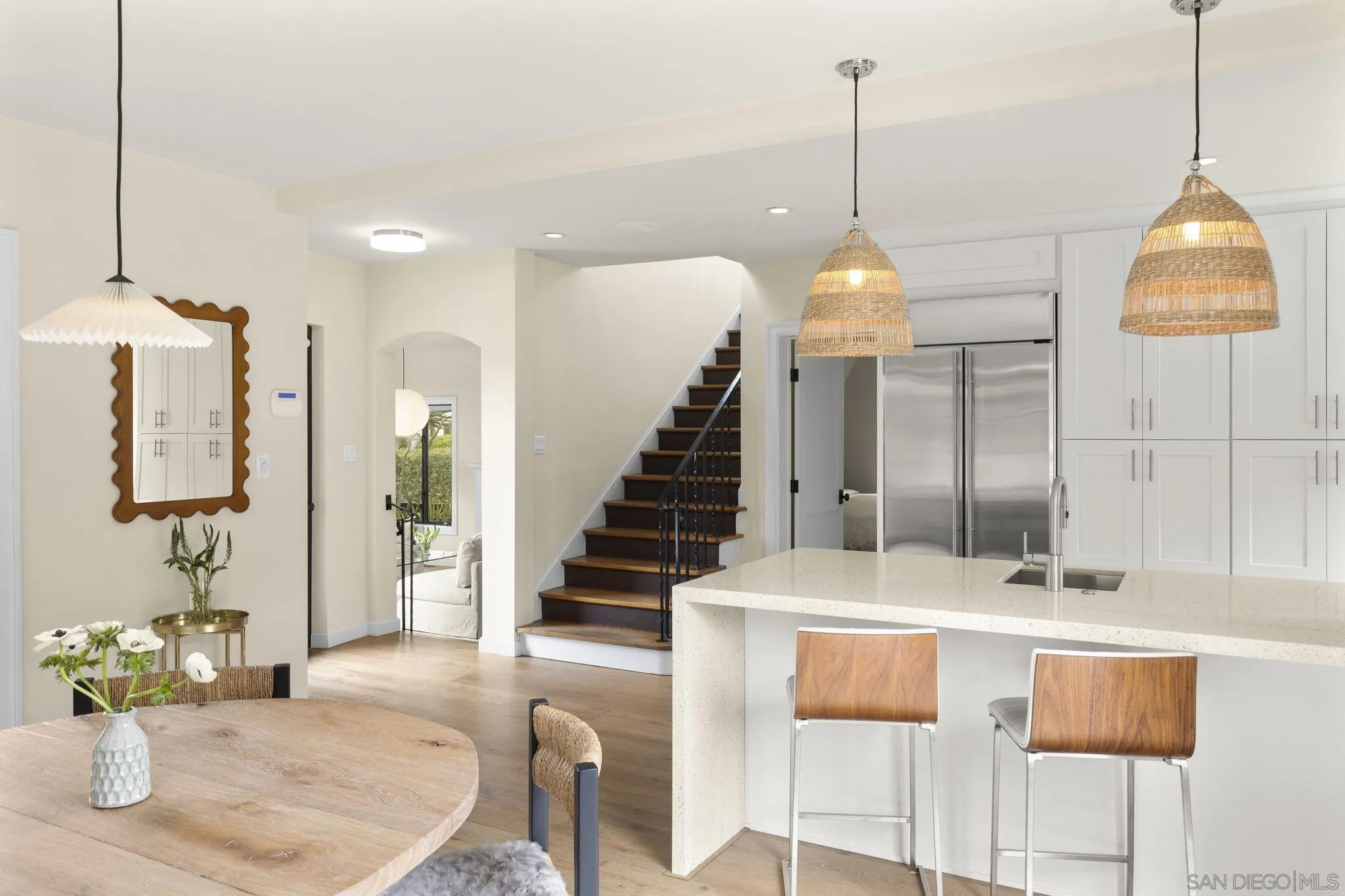 321 Fern Glen La Jolla, CA 92037 - Photo 7 of 46 a dining room with a table and chairs
