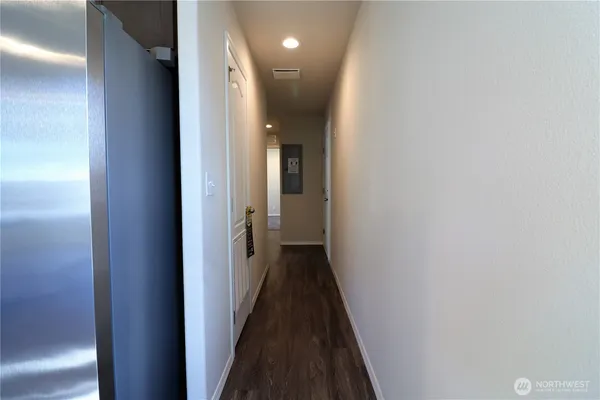 a view of a hallway with a white walls