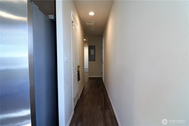a view of a hallway with a white walls