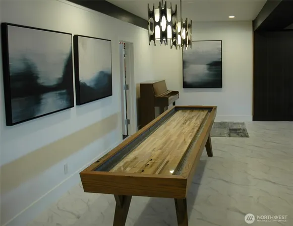 a room with pool table and glass door