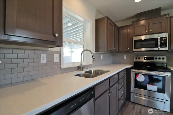 a kitchen with a sink and cabinets