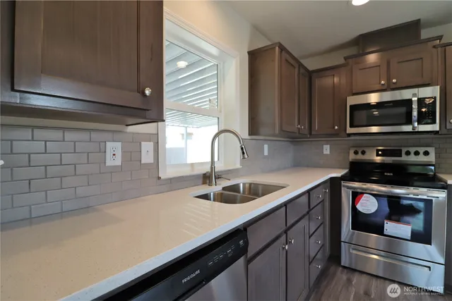 a kitchen with a sink and cabinets