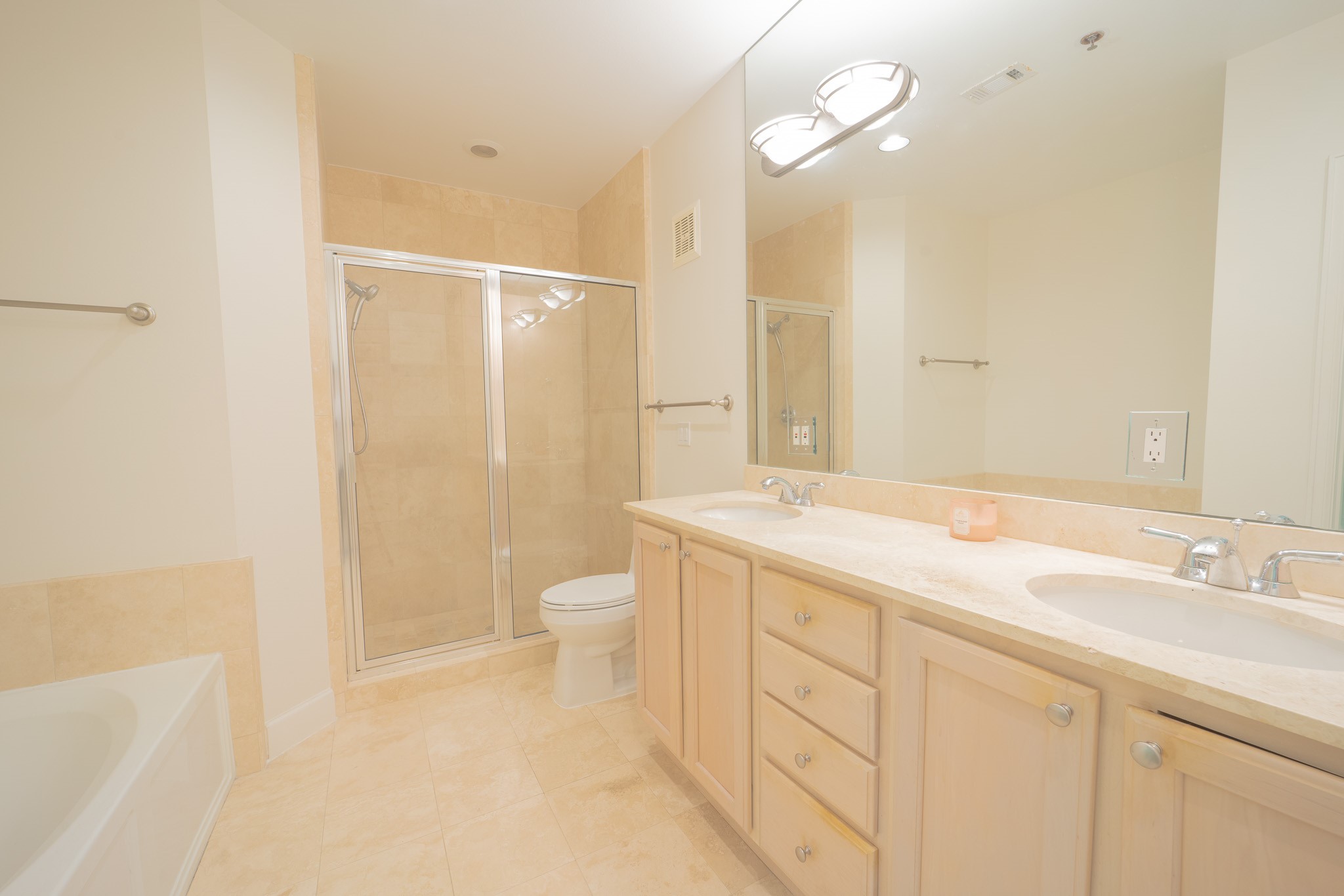 2520 Robinhood Street, Unit 505 Houston, TX 77005 - Photo 32 of 37 a bathroom with a granite countertop sink a toilet and shower