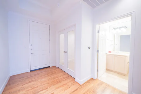 a white toilet sitting next to a bathroom sink