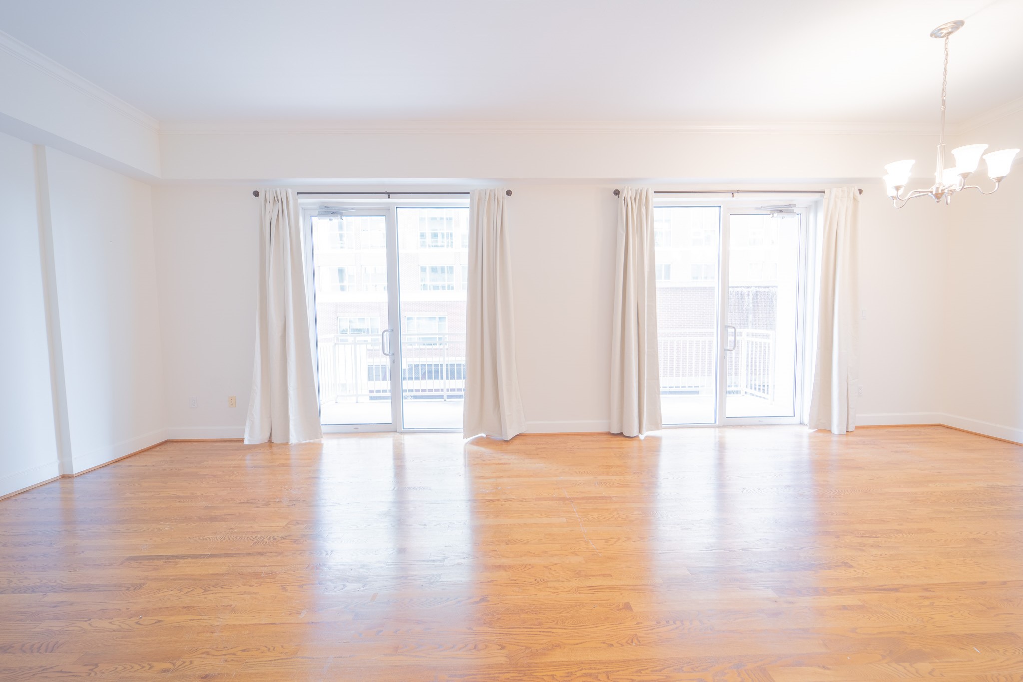 2520 Robinhood Street, Unit 505 Houston, TX 77005 - Photo 9 of 37 a view of an empty room with window and wooden floor
