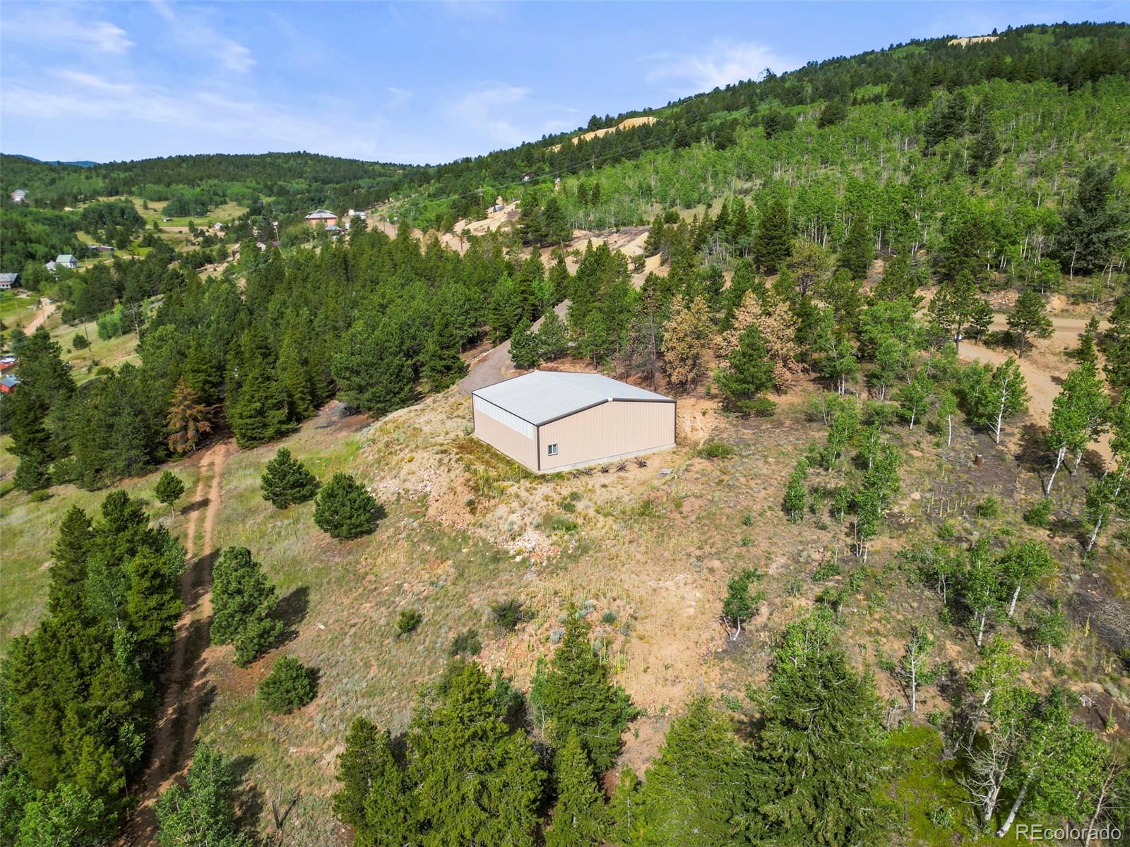6660 Virginia Canyon Road Central City, CO 80427 - Photo 12 of 31 a view of a field with an ocean and trees