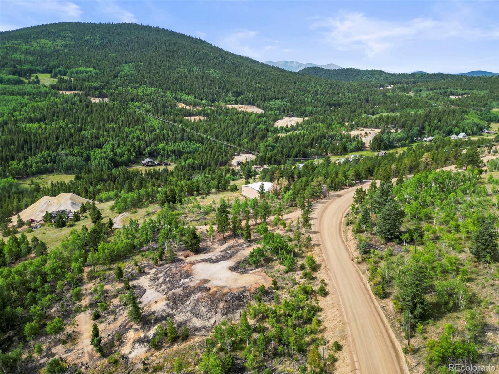 6660 Virginia Canyon Road Central City, CO 80427 - Photo 13 of 31 a view of a city with lush green forest