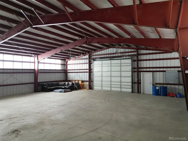 a view of empty room with wooden ceiling