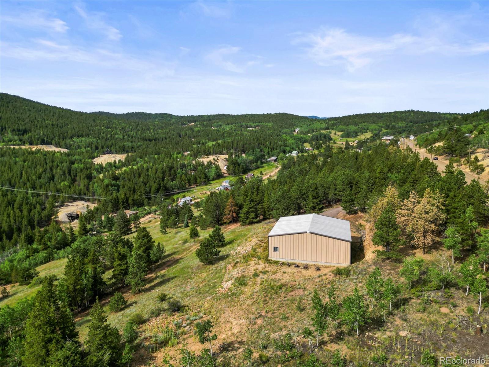 6660 Virginia Canyon Road Central City, CO 80427 - Photo 5 of 31 an aerial view of residential house with green space and fog