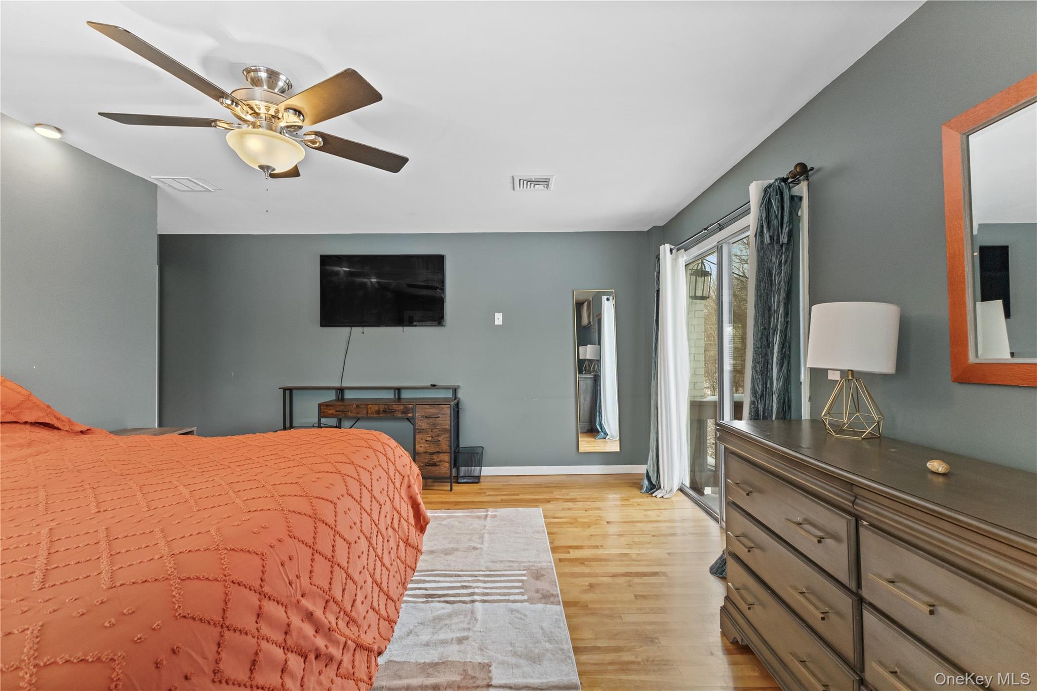 10 Helin Road Hopewell Junction, NY 12533 - Photo 21 of 35 Bedroom with light wood floors, ceiling fan, and access to private deck