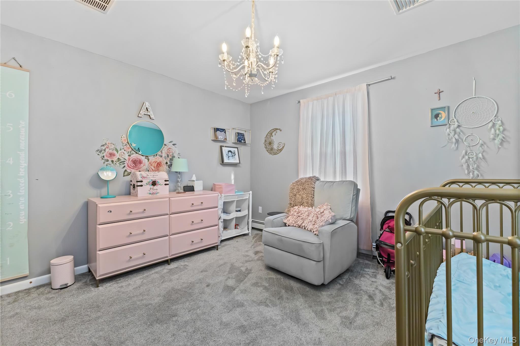 10 Helin Road Hopewell Junction, NY 12533 - Photo 22 of 35 2nd bedroom Carpeted with and a chandelier