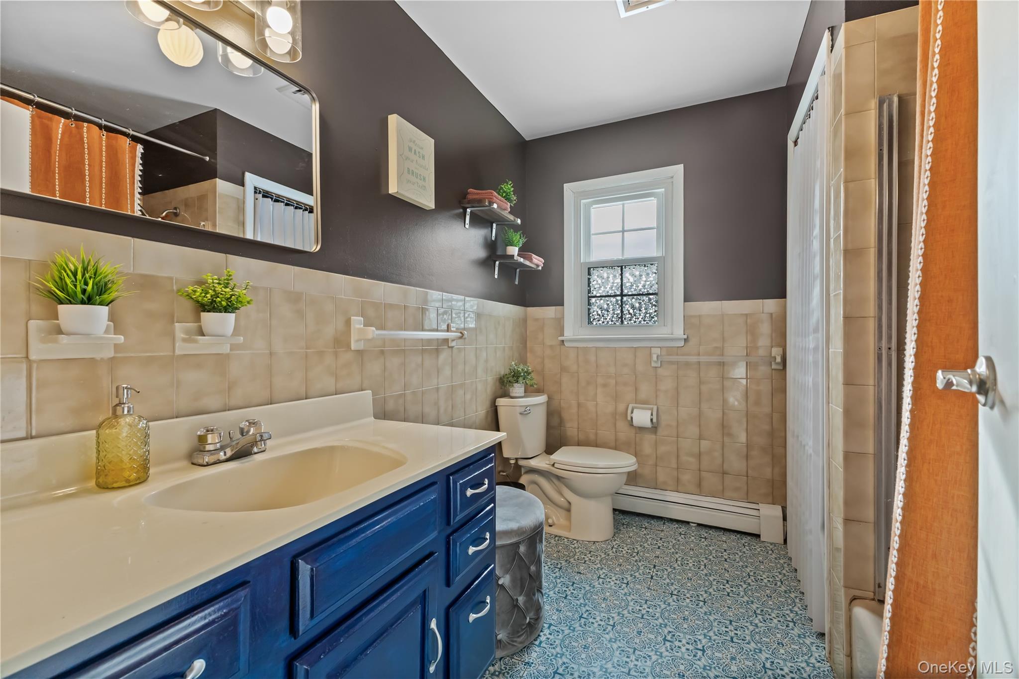 10 Helin Road Hopewell Junction, NY 12533 - Photo 24 of 35 Full Bathroom featuring vanity, baseboard heating, tile walls, and wainscoting